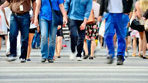 People walking in a pedestrian crosswalk