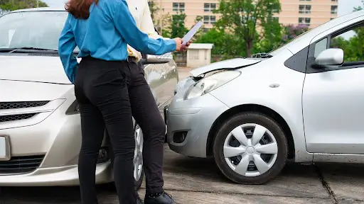 Police officer taking car accident report as evidence